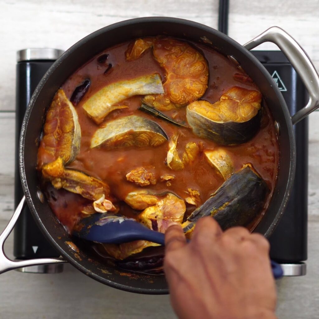 adding fish and mixing