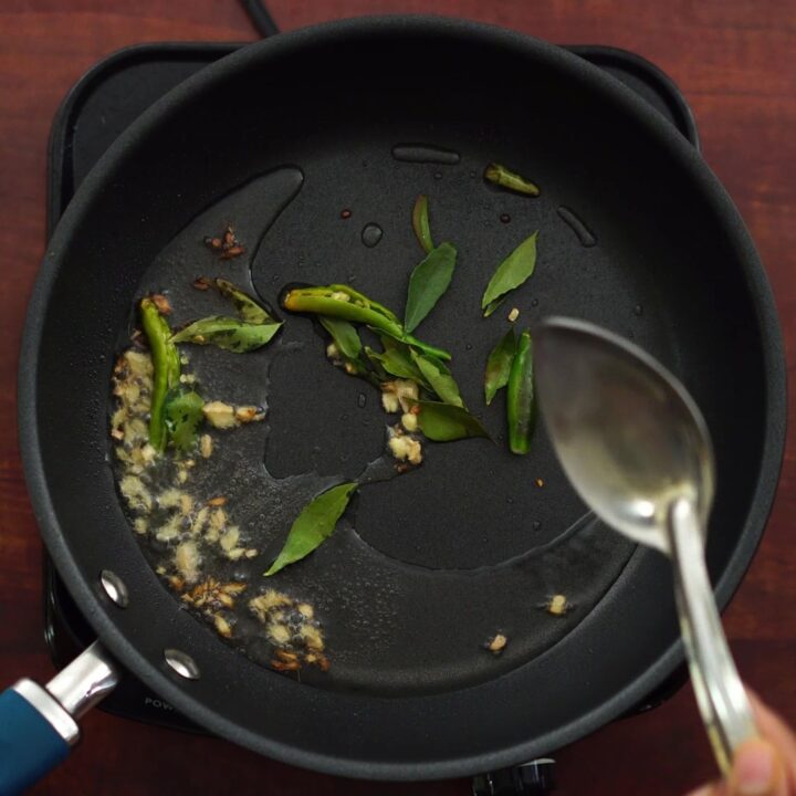 adding oil, chili etc in a hot pan