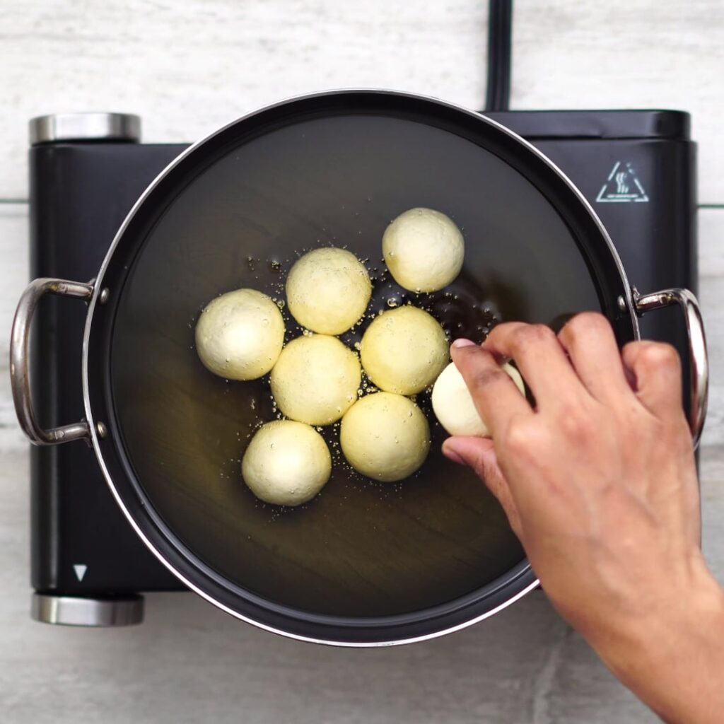 Adding dough in medium hot oil