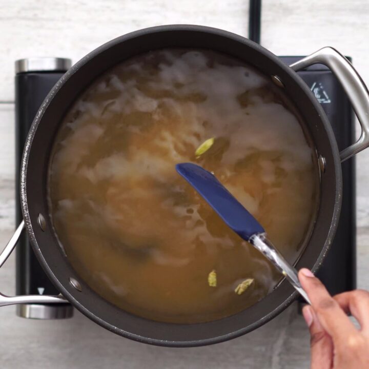 Mixing sugar in water for syrup