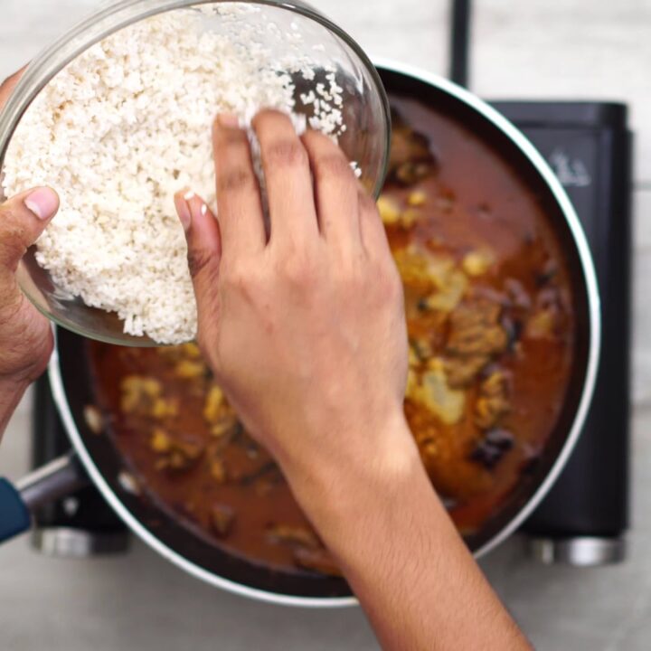 Adding seeraga samba rice into gravy