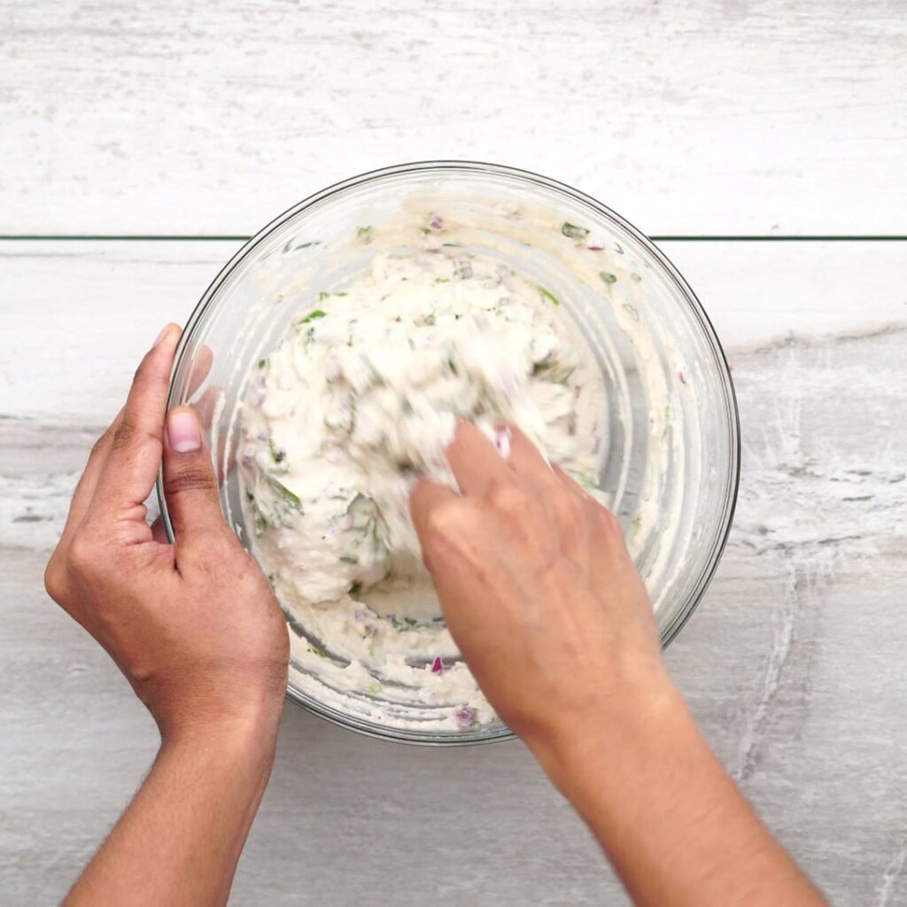 Combining Urad batter and ingredients