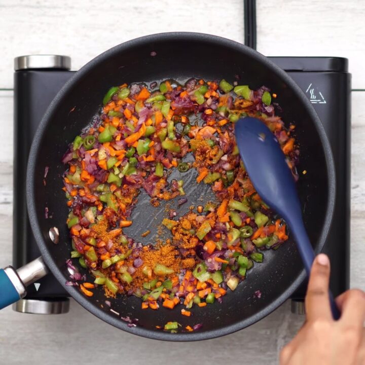 Adding green chili, masala and mixing