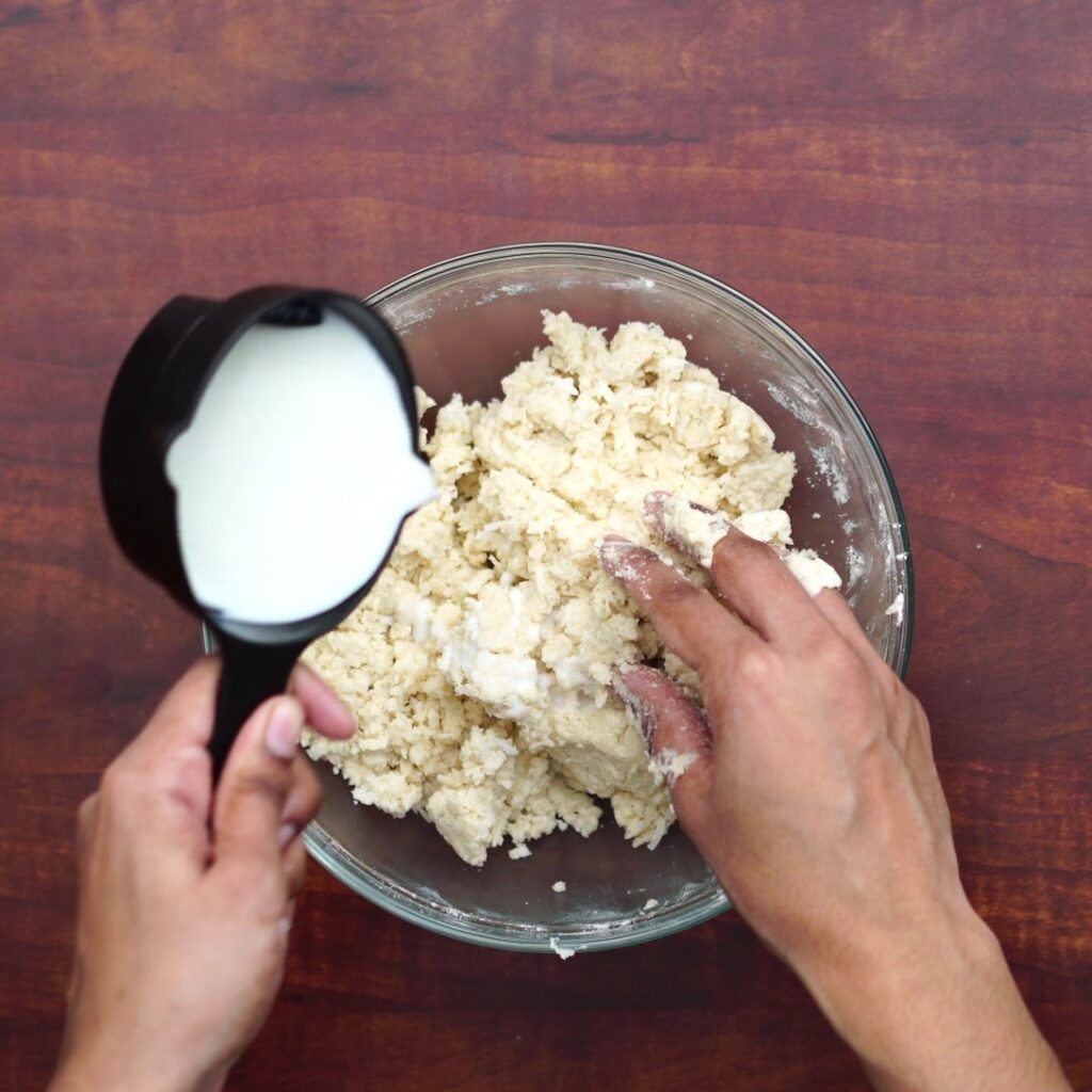 adding milk and mixing
