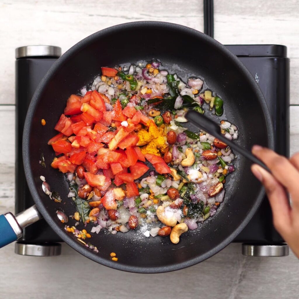adding tomato and sauteing