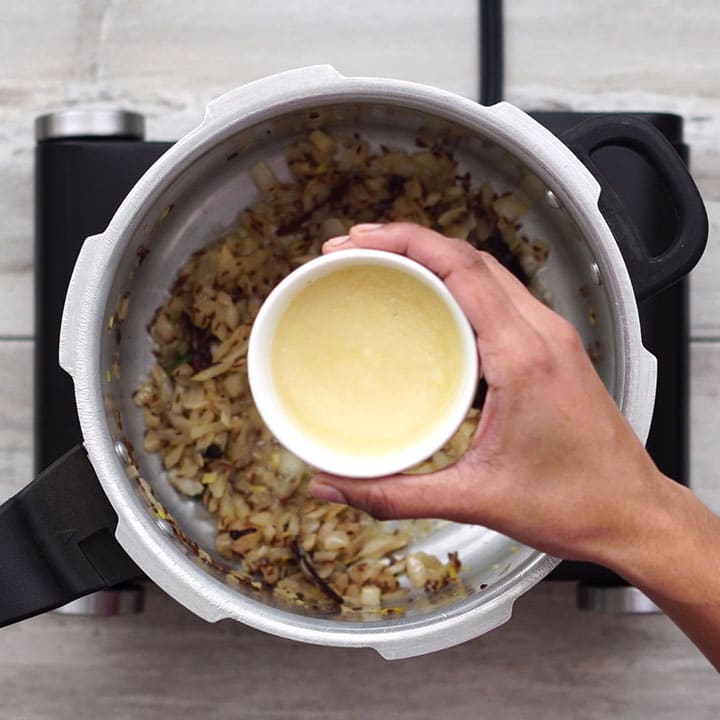 Adding ginger garlic past and mixing