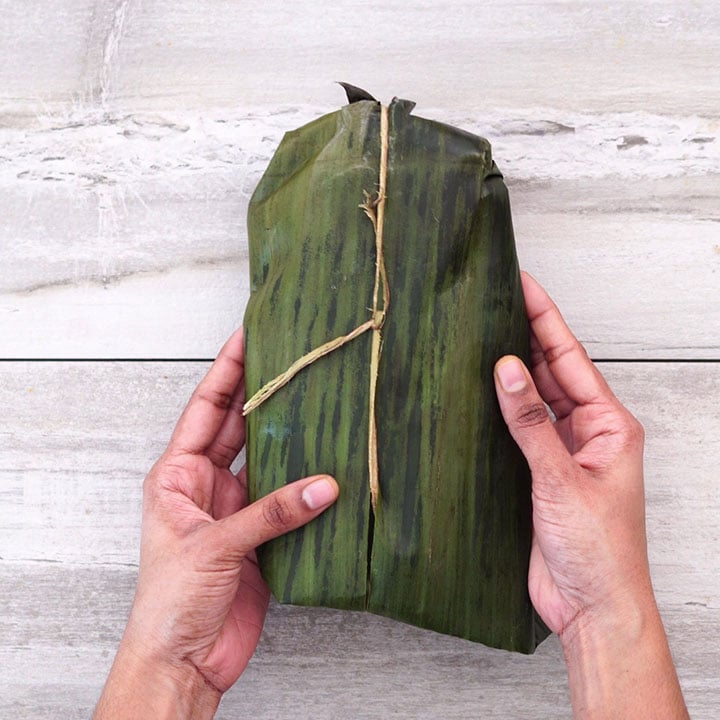 Wrapping the fish in banana leaf
