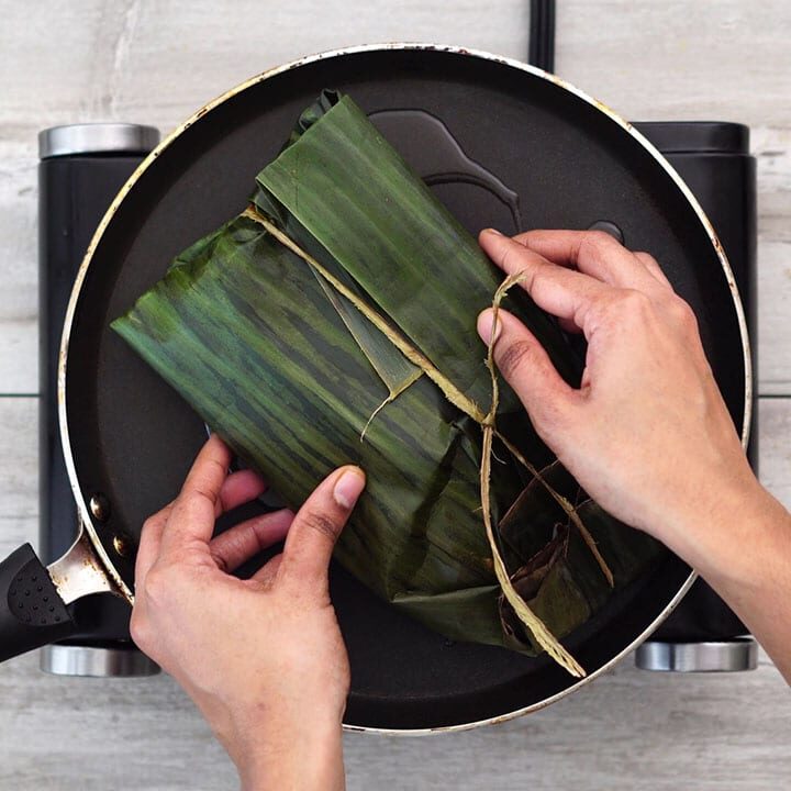 Cooking wrapped fish in a pan