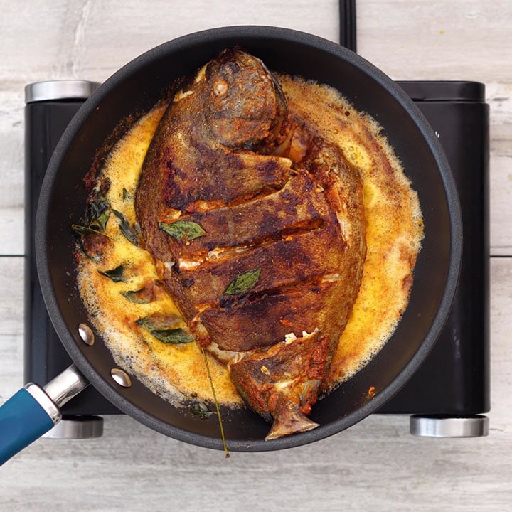 Frying fish in a pan