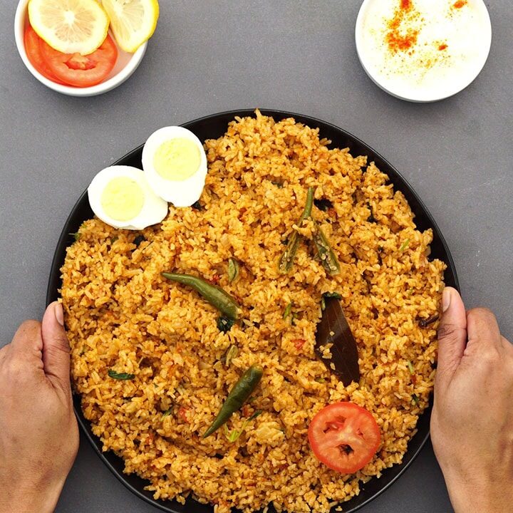 serving the plain biryani rice