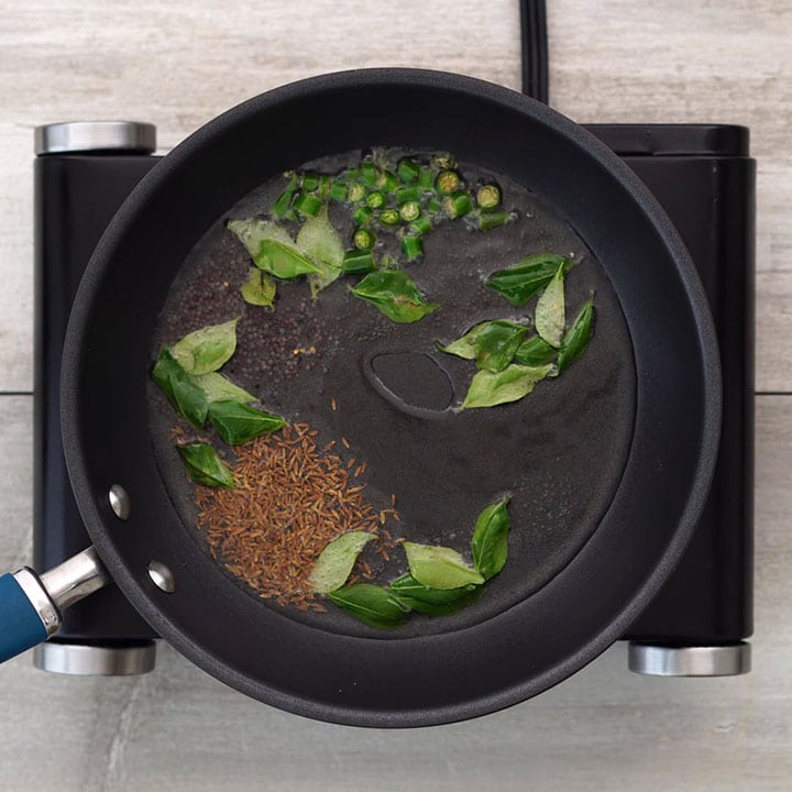 Adding Indian spices in oil and sauteing