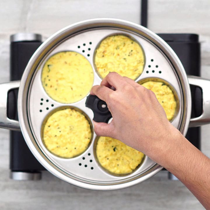Transferring idli mold into a pan