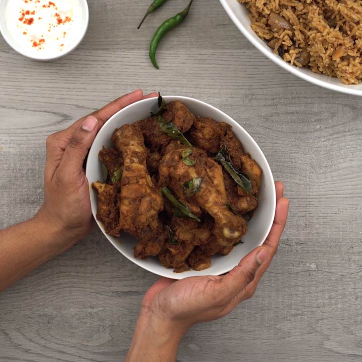 serving the spicy Andhra kodi/chicken/kozhi vepudu