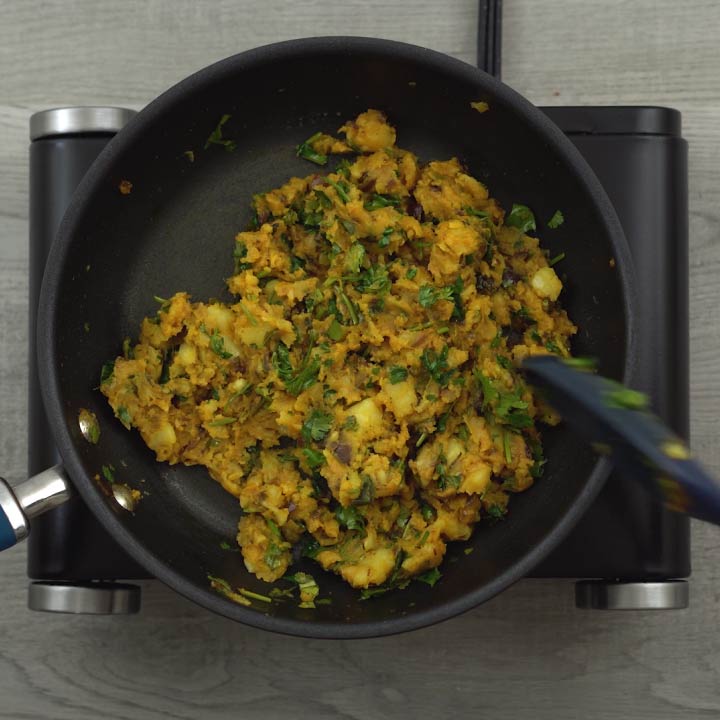stirring in coriander leaves
