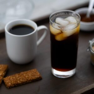 Hot Black Coffee and Iced Black coffee placed on a tray.