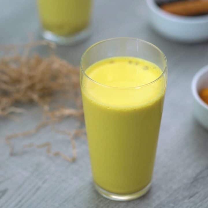 Golden Milk also called turmeric milk served in a serving glass.