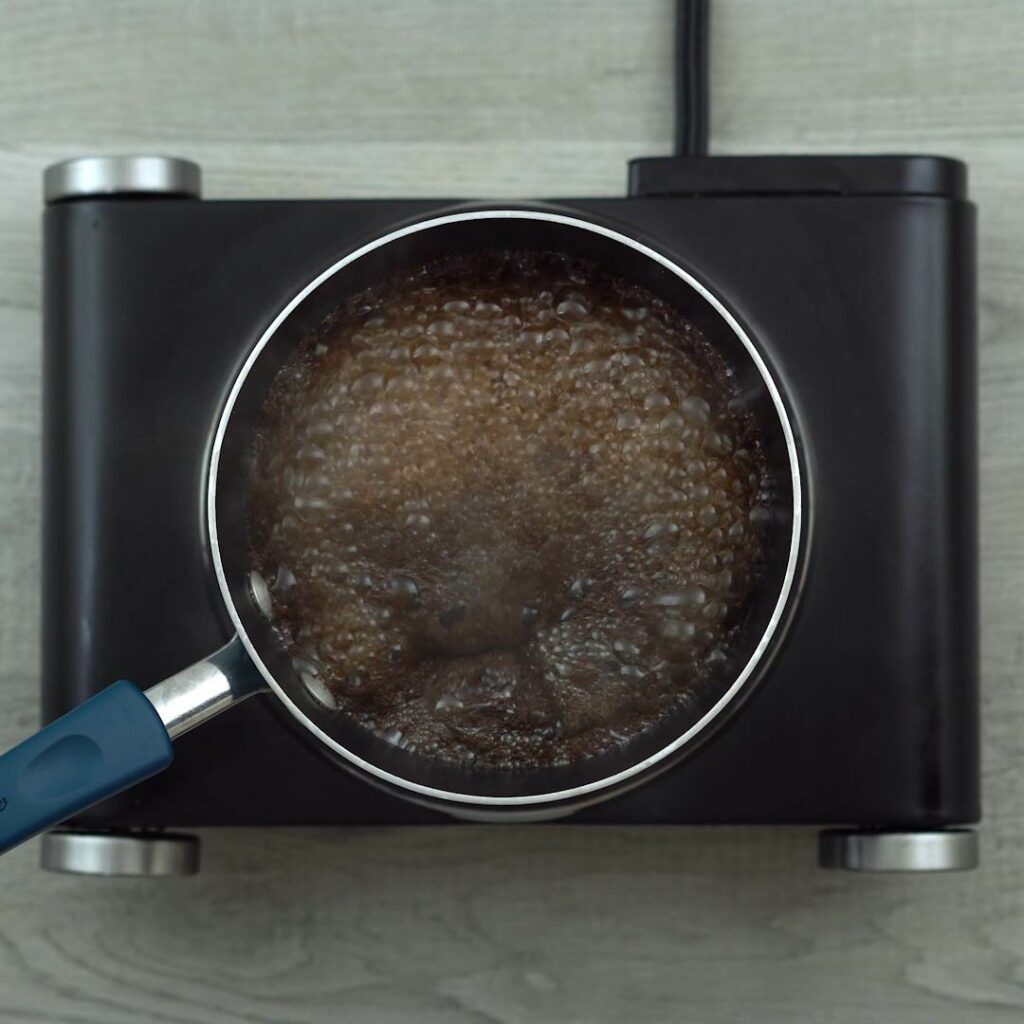 Tea brewing in a saucepan.