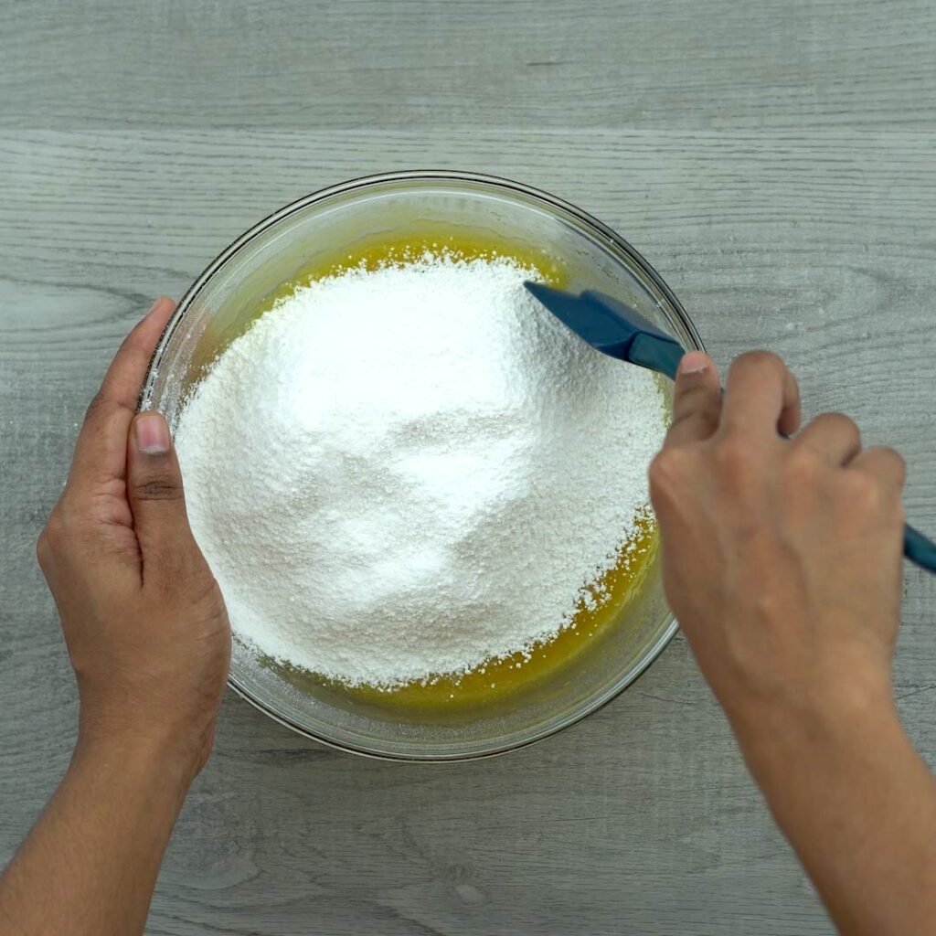 Mixing flour with mango pulp mixture
