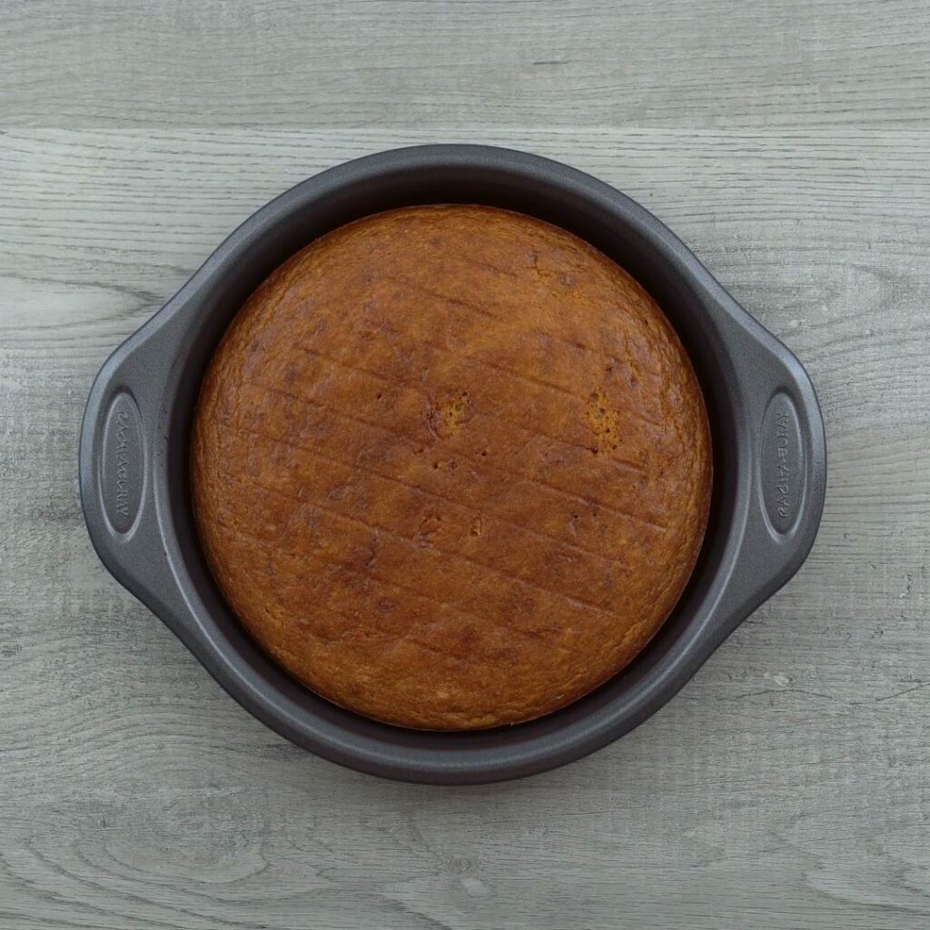Baked Mango cake in a cake pan