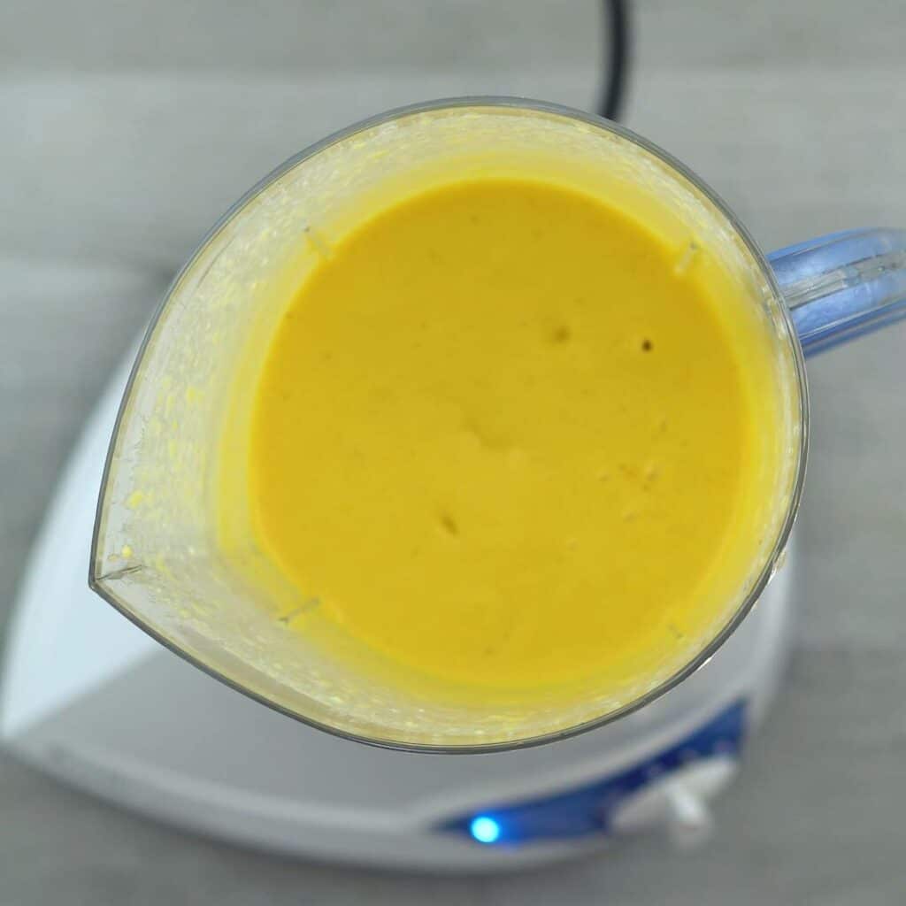 Creamy Mango Lassi in blender jar.