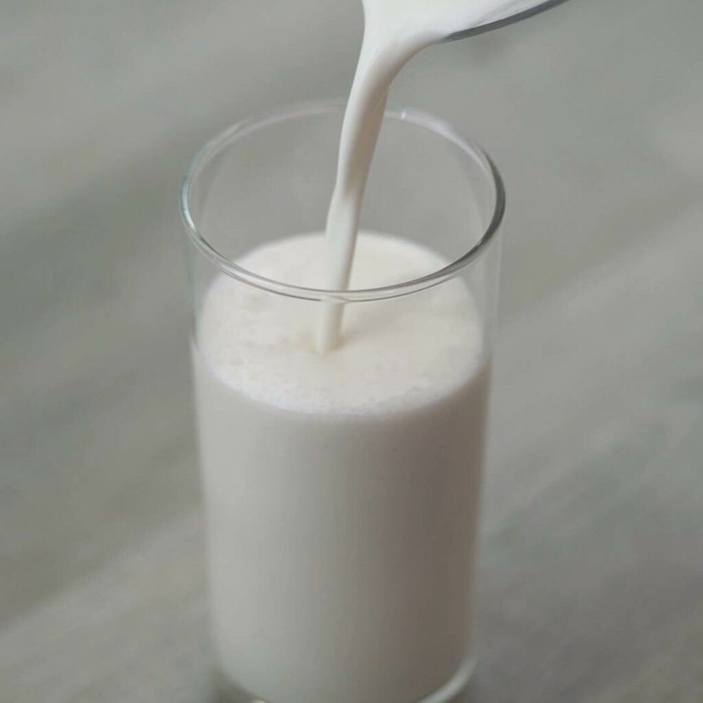 Pour Vanilla Milkshake into a serving glass.