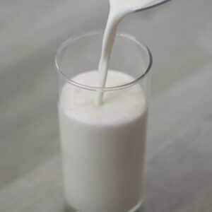 Pour Vanilla Milkshake into a serving glass.