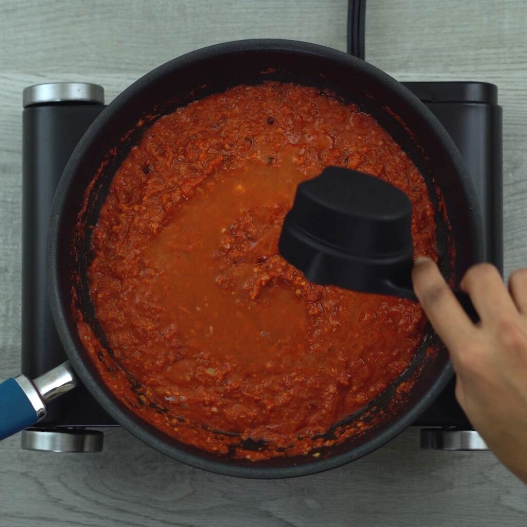 adding water to chili paste