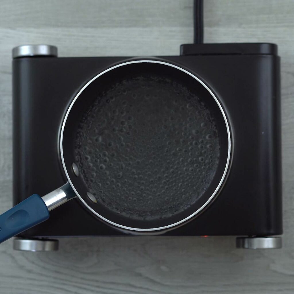 Water boiling in saucepan.