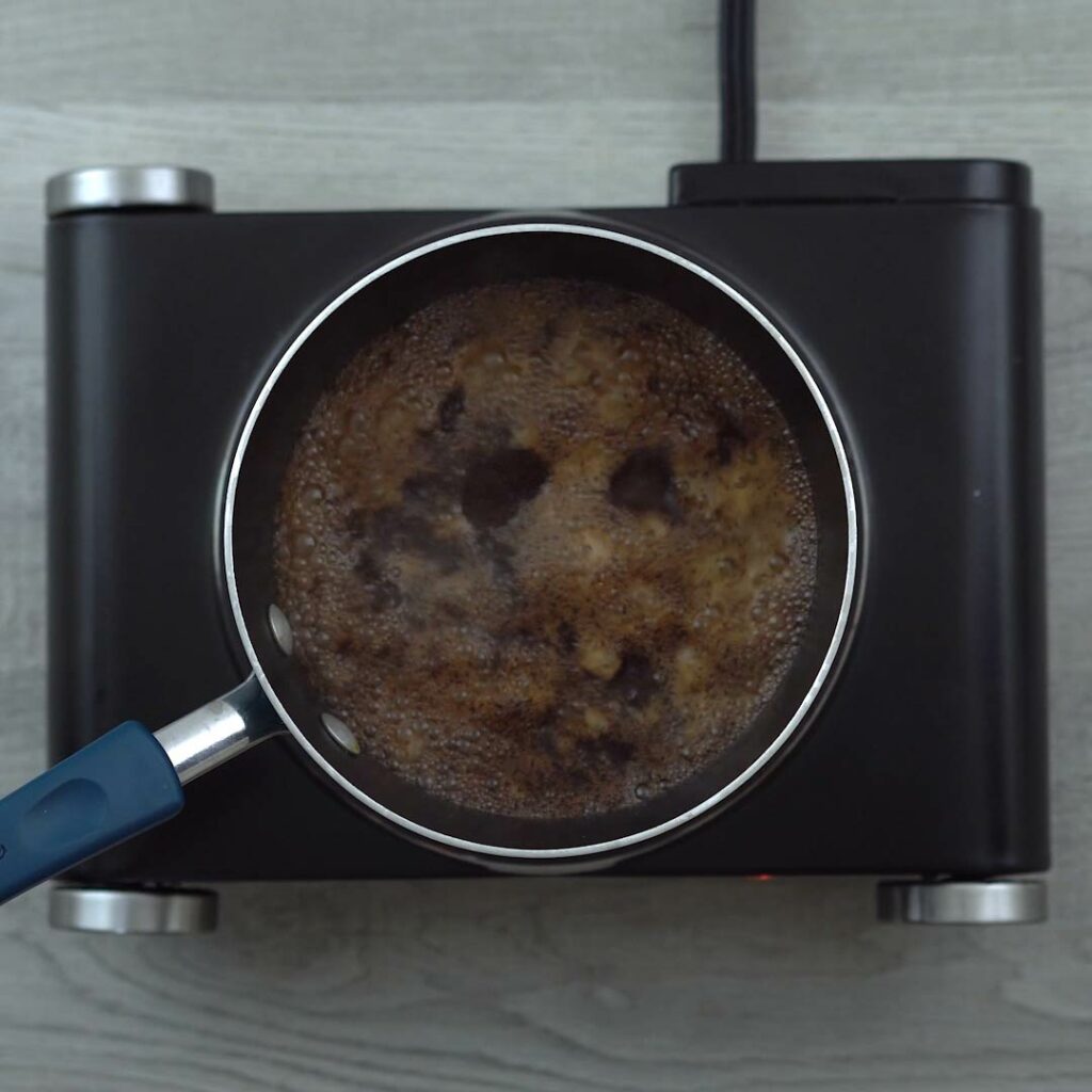 Coffee brewing in saucepan.