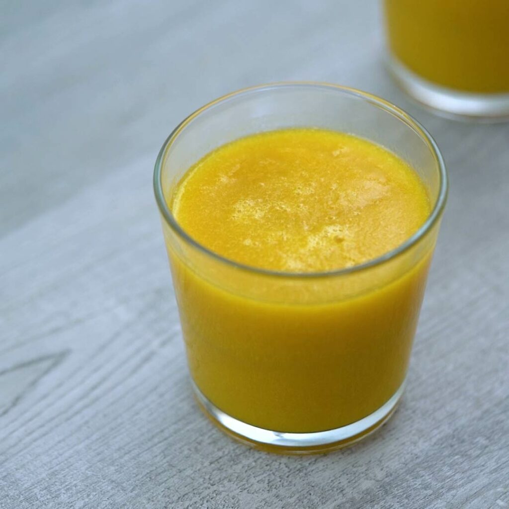 Mango juice served in a glass.