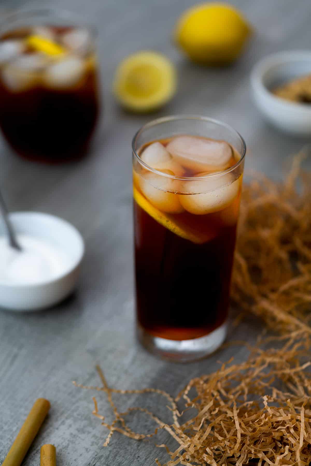 Sweet tea served with ice cubes and lemon slice.