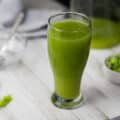 Celery Juice served in a glass with chopped celery in a bowl.