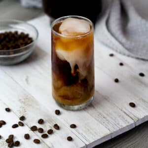 Cold brew coffee in a serving glass with swirls.