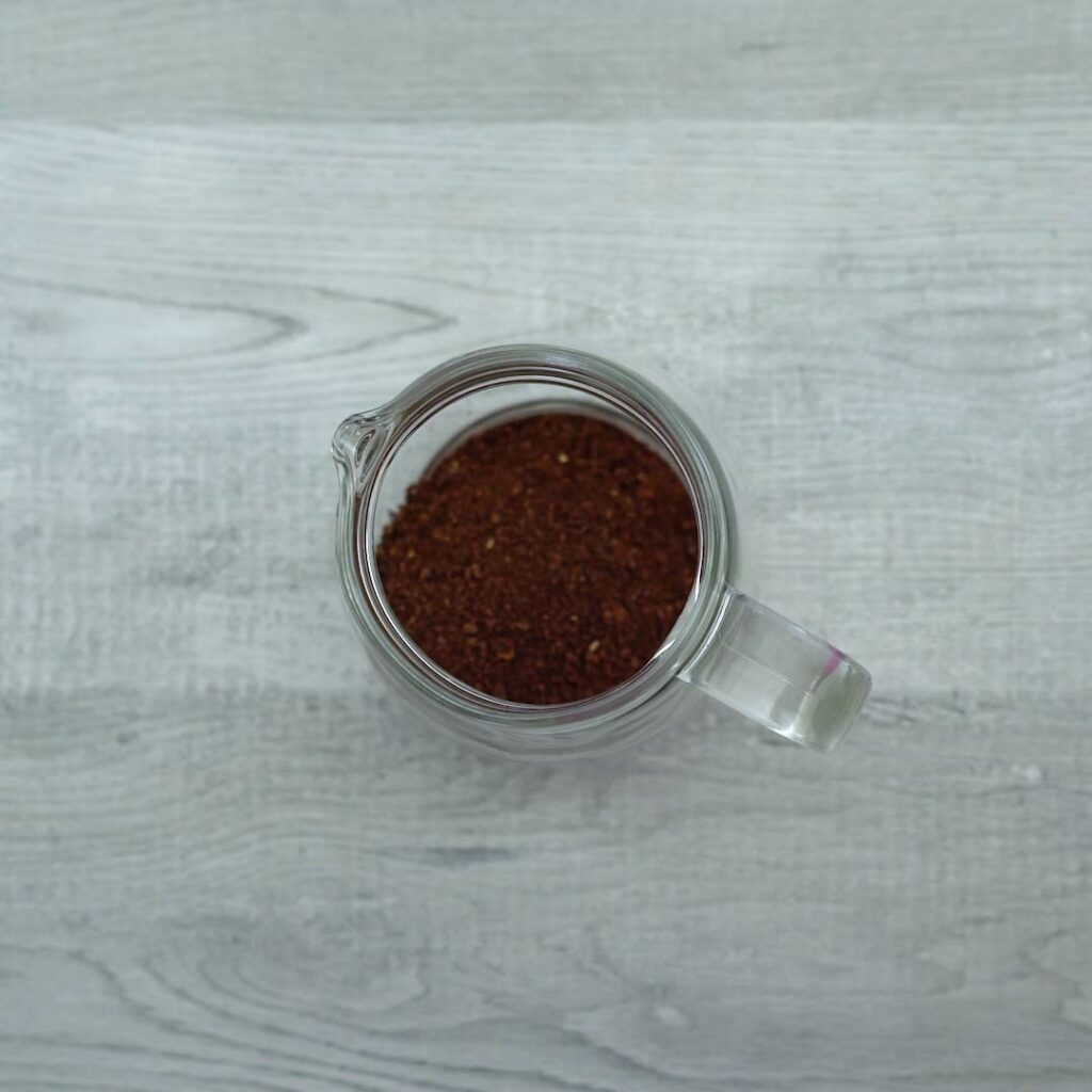 Coffee powder in pitcher.
