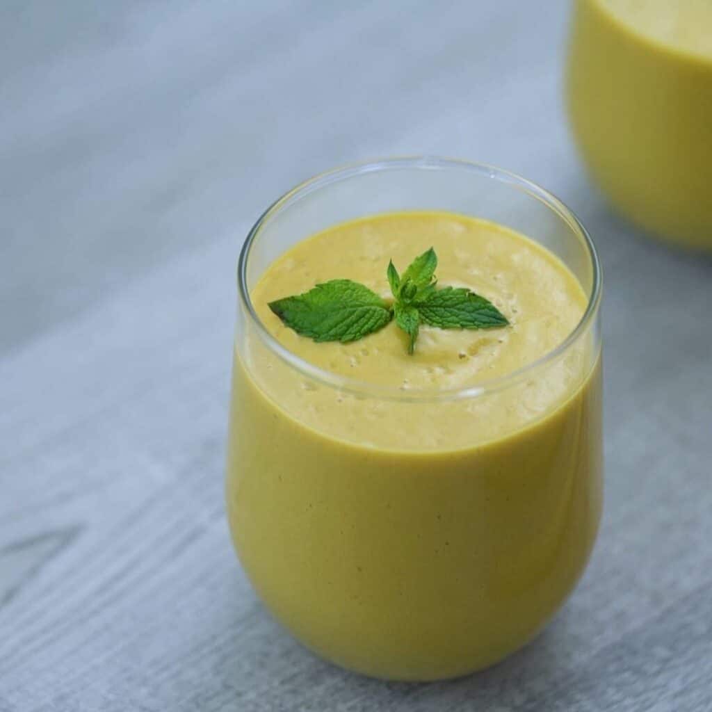 Mango Smoothie is served in a glass.