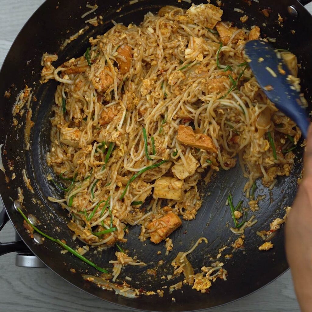 Pad Thai noodles being tossed