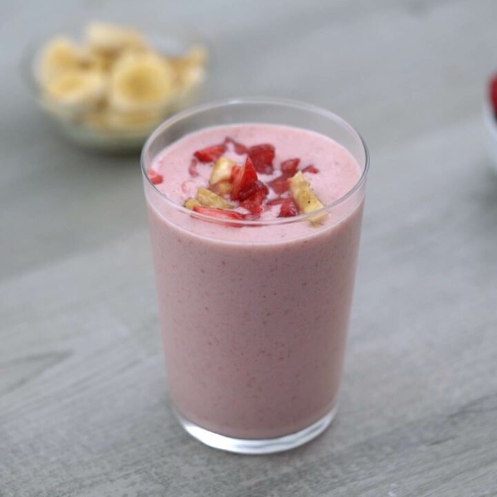 Strawberry Banana Smoothie is served in a glass.