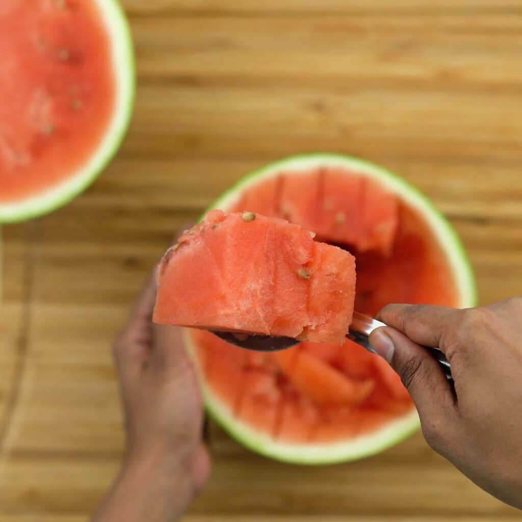 Scooping the watermelon pieces