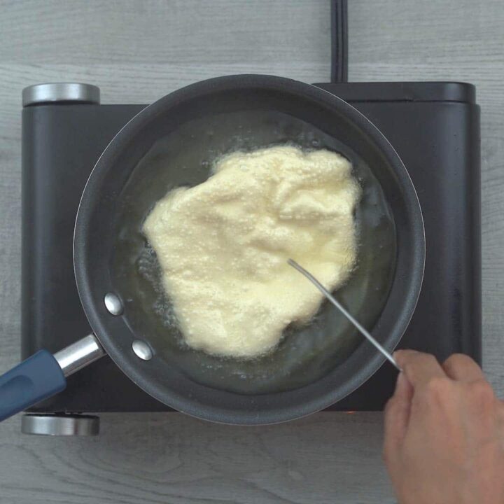 Frying Poppadom in oil