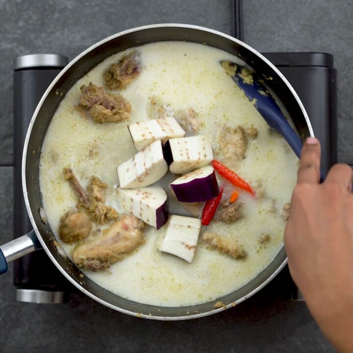 coconut milk, eggplant, chili is added to chicken
