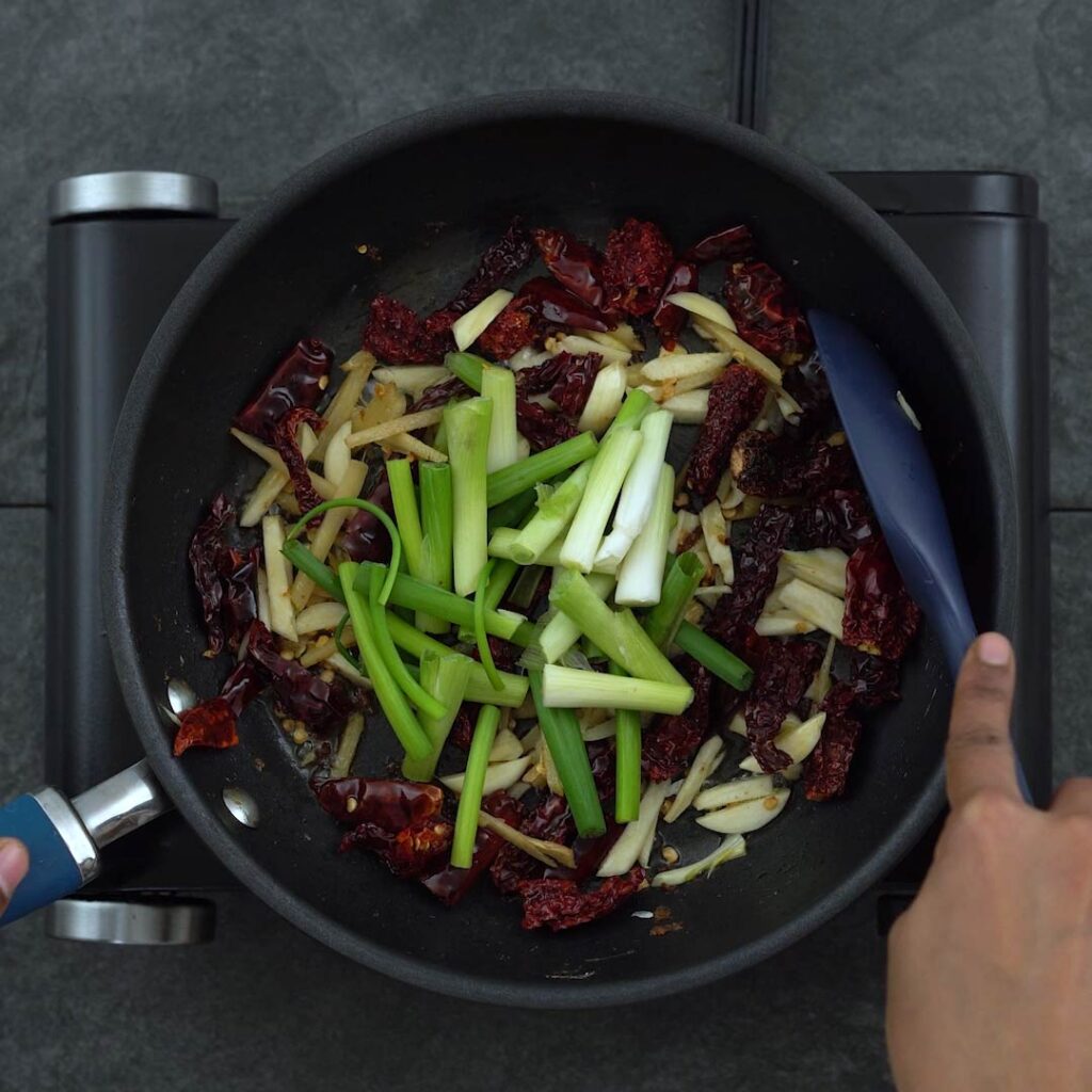 sautéing the scallions