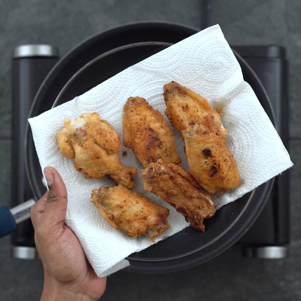 crispy fried chicken wings drained from oil