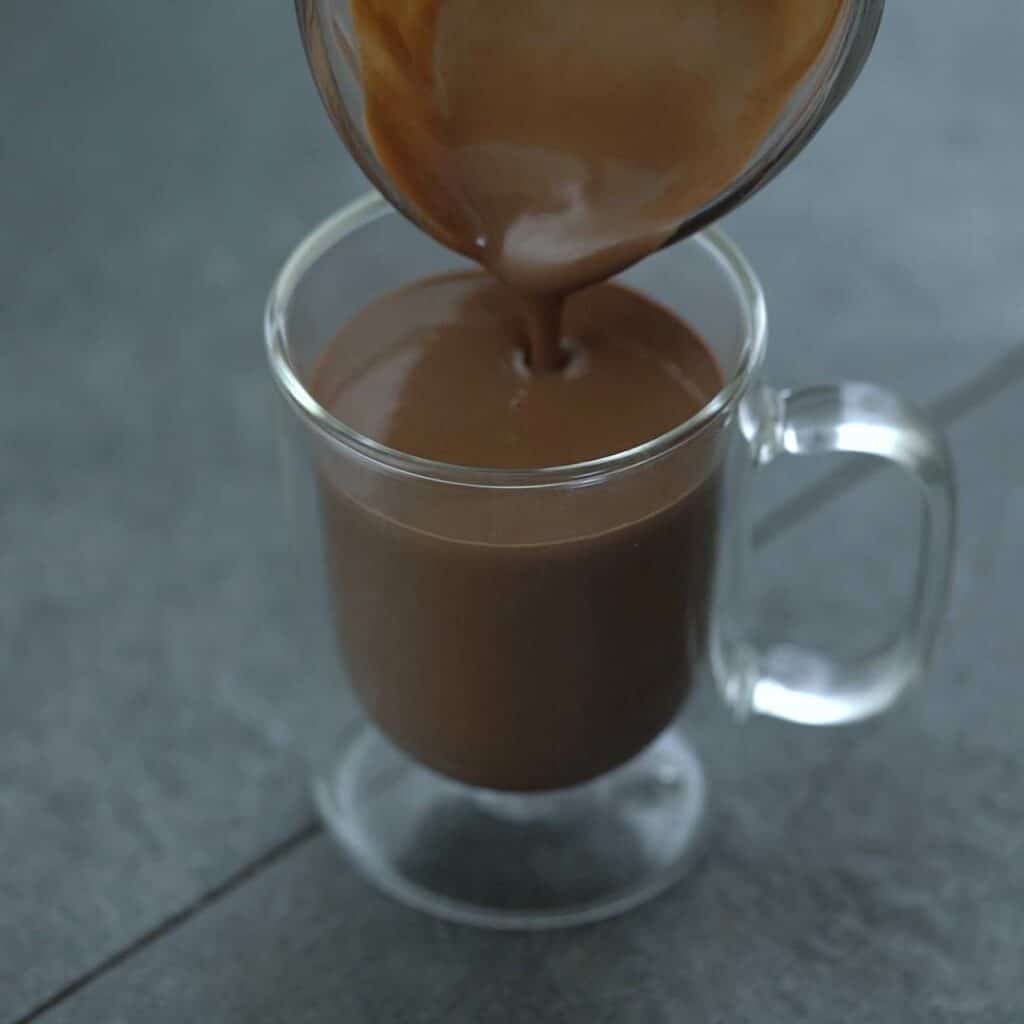 Pour the Mexican Hot Chocolate into serving glass.