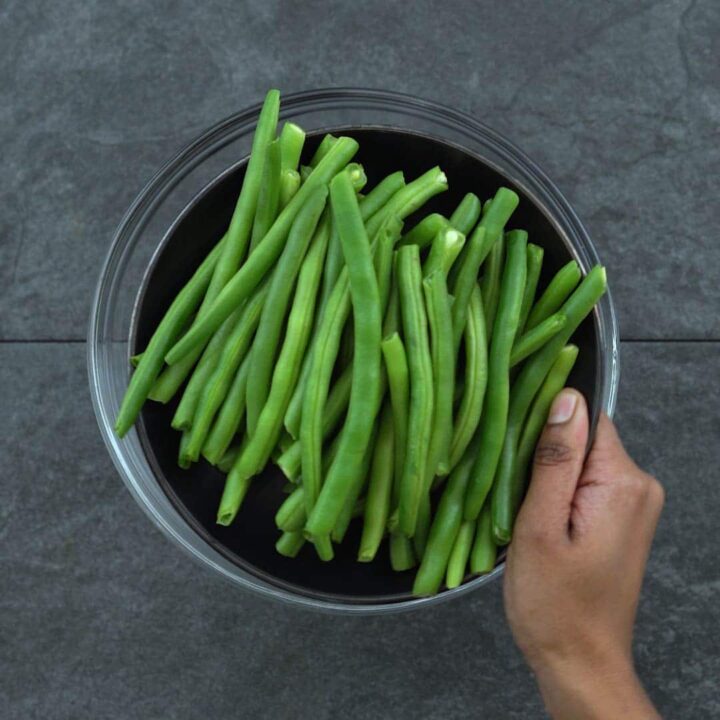 trimmed fresh green beans in a plate