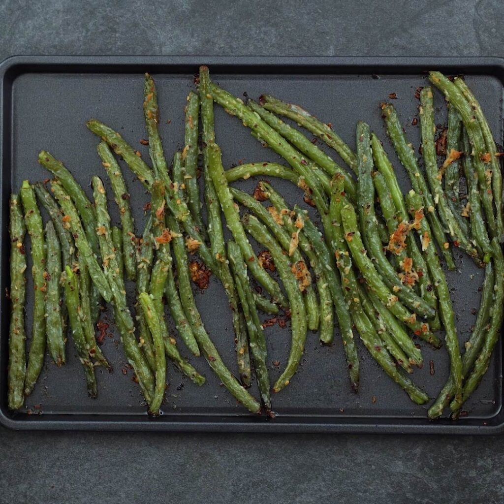 roasted green beans in a baking tray