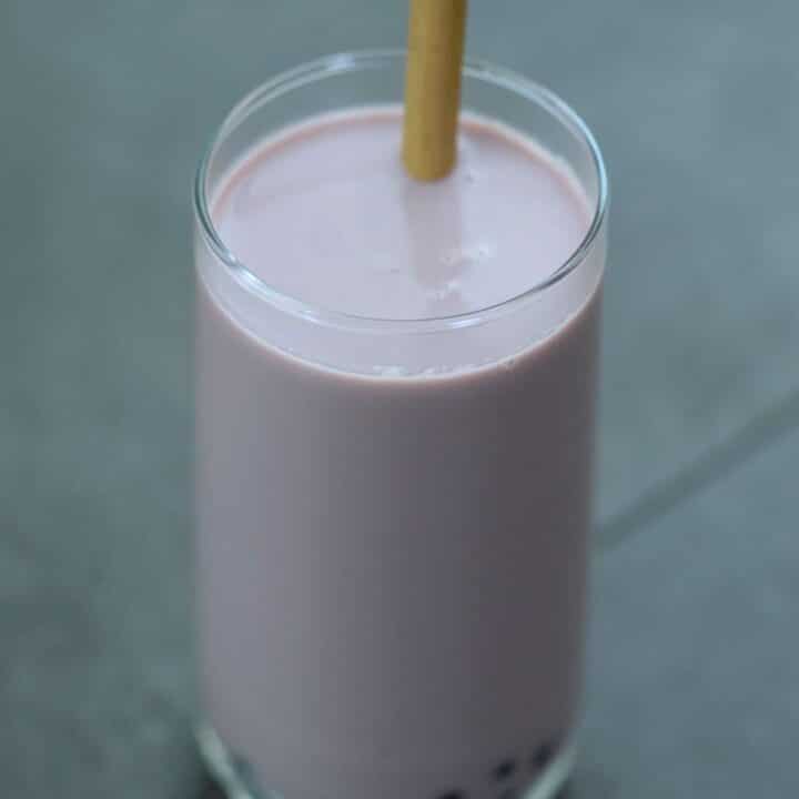 Taro Milk Tea served in a tall glass.
