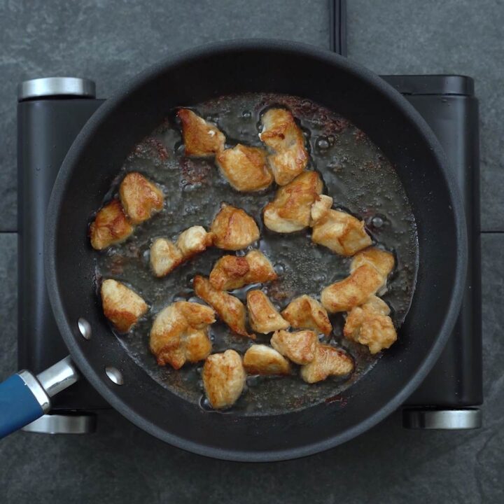 golden brown chicken in a pan