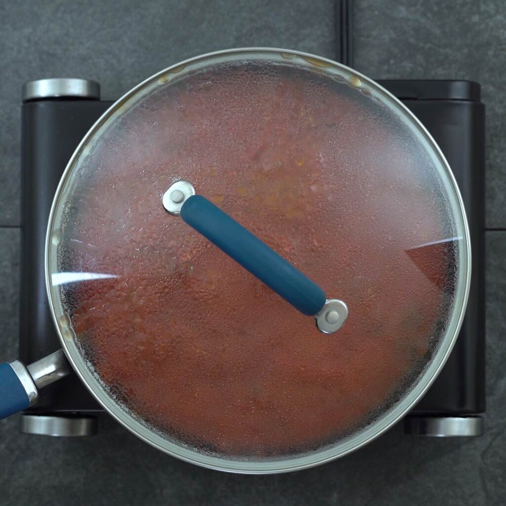 pasta sauce cooking in a closed pan