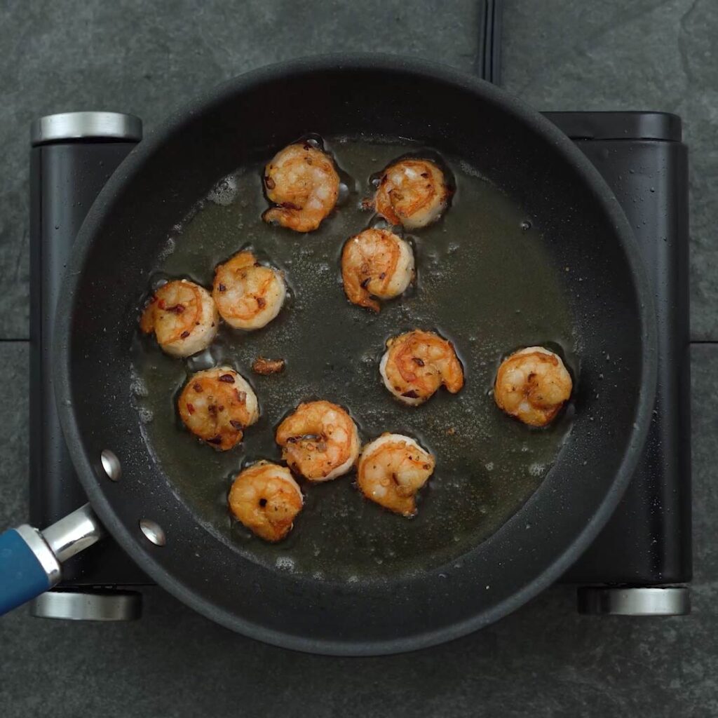 flip and frying the shrimp in oil