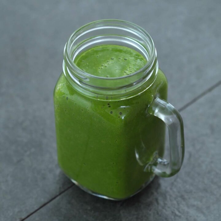Healthy Green Smoothie served in a mug.